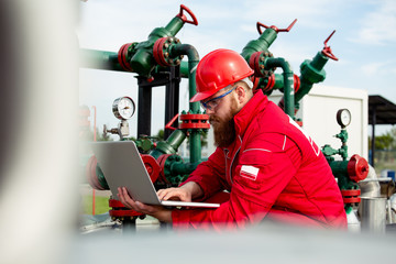 Engineer power and energy using laptop. 