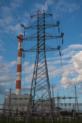 Wall Mural - View of a power plant with many power lines on a background of beautiful cloudy sky