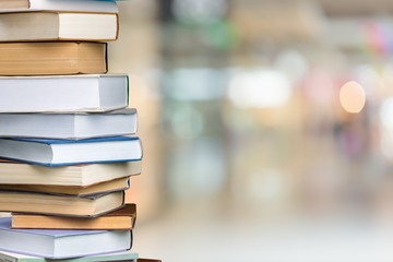 Poster - Collection of old books stack on blur background