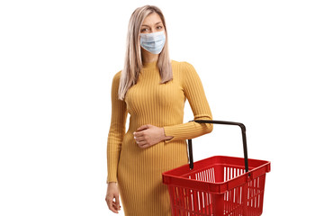 Poster - Woman with a shopping basket wearing a protective face mask