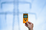 Fototapeta Storczyk - Electromagnetic radiation measuring under high voltage power transmission towers