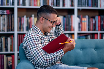 Young student learning in the library.