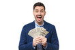 © Damir Khabirov - WOW! Young man shouting with joy as he is holding fan of euro notes in cash that he won in lottery, feeling excited and happy, isolated on white background