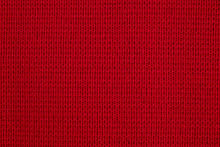 Texture Of Knitted Wool Fabric Close-up. Red Knitted Background.The Texture Of The Red Wool Knitted Fabric.