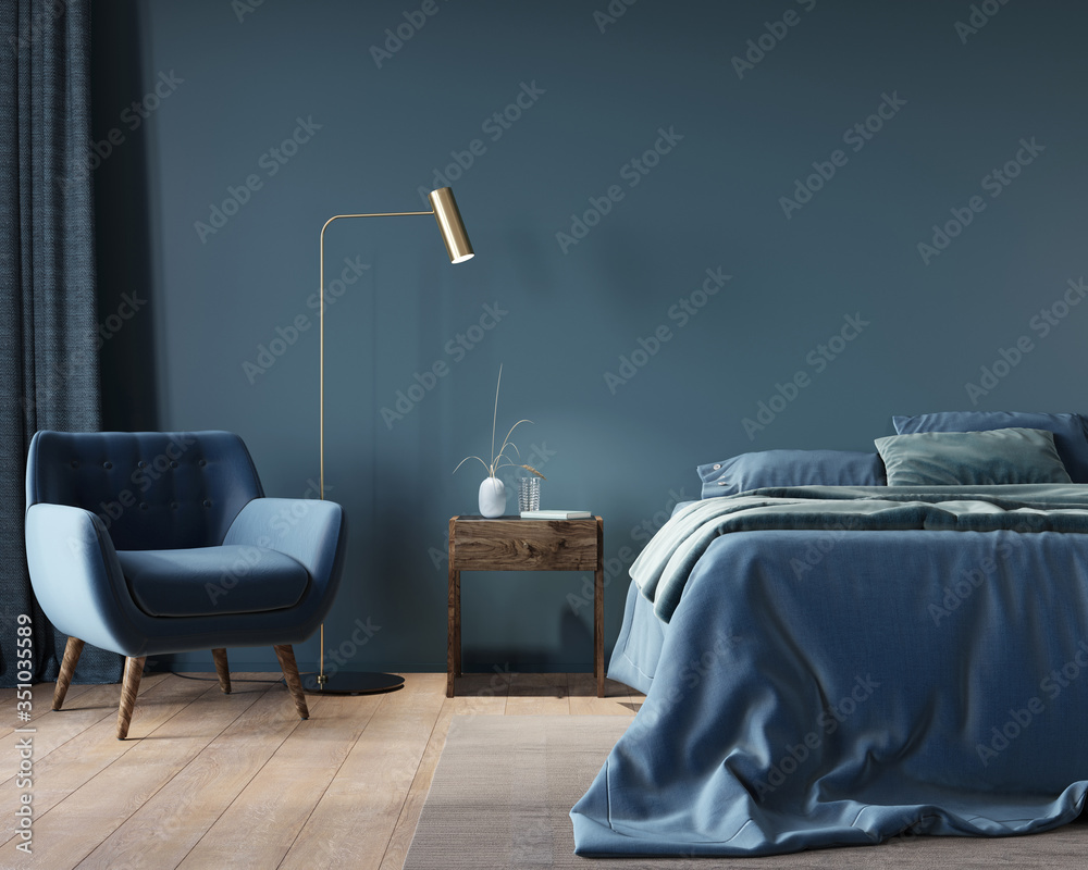 The interior of the bedroom in dark blue with a wide bed, a wooden nightstand and a golden floor lamp - obrazy, fototapety, plakaty 