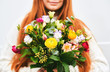 © annanahabed - Young girl holding beautiful bouquet with a variety of flowers