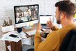 Video conference. Business partners communicate via video using laptop. The guy talks with his business partners appearance about plans and strategy. Distant work