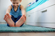 © Oksana - The boy trains in his room. Close-up of the feet. The concept of a healthy lifestyle. Sports at home.