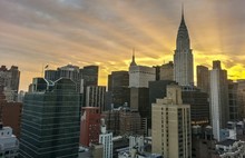 Chrysler Building In City Against Cloudy Sky During Sunset