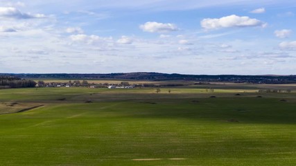 Wall Mural - Rural landscape at spring, hyperlapse. Aerial views farmland, Belarus.
