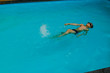 © Konstantin - Young boy is swimming on his back in the swimming pool. sport vacation