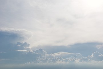 Deep blue skies with white clouds background with space for text, blue cloudy skies texture, dark blue sky wallpaper with with white fully clouds and sunlight