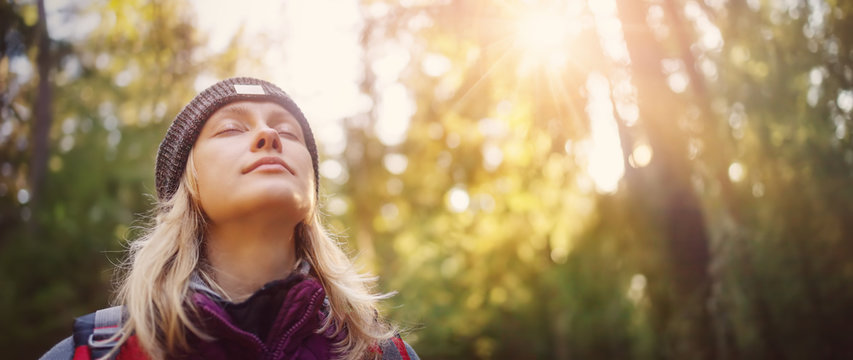 young woman hiking and going camping in nature