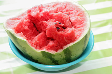 Broken watermelon placed in a blue plate