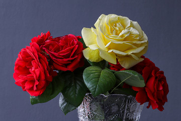 Yellow and red rose flower in vase