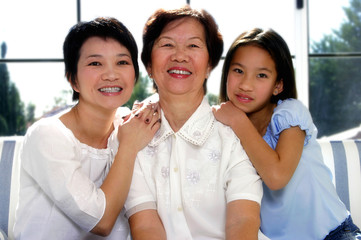 Wall Mural - Girl posing with her mother and grandmother