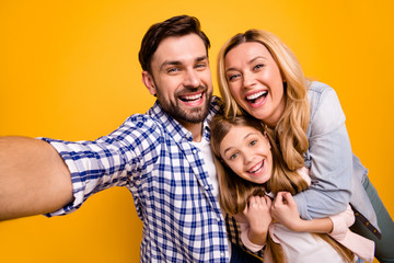 Sticker - Closeup photo of mom lady handsome dad little daughter spend quarantine together taking selfies having fun bloggers hugging laughing wear casual shirts isolated yellow color background