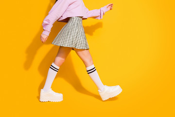 Poster - Cropped view photo of charming millennial girl go walk hurry for her meeting with friends wear good look pullover isolated over vibrant color background