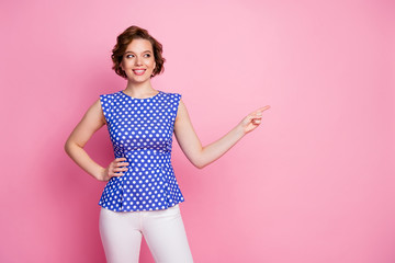 Poster - Portrait of her she nice-looking attractive lovely pretty cheerful cheery wavy-haired girl demonstrating ad advert copy space isolated over pink pastel color background