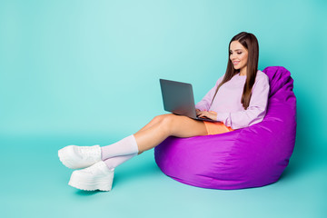 Canvas Print - Full body profile photo of charming lady sit comfy bean bag chair hold notebook freelance working wear purple sweater orange skirt sneakers socks isolated teal color background