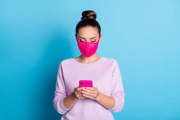 Poster - Photo of attractive beautiful lady influencer keep social distance not contact people hold telephone browsing blog wear protect face mask violet pullover isolated blue color background