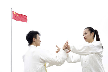 Man and woman practising martial arts