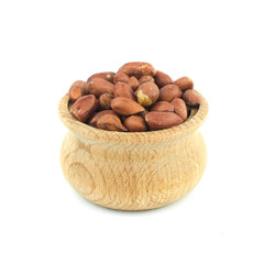 Wall Mural - Peanuts in wood bowl close up isolated on white background..