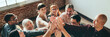 © rawpixel.com - People joining hands in the air at a meeting