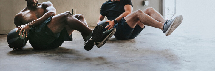 sportive men working out with fitness balls