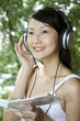 © ImageHit - Woman listening to music with headphones