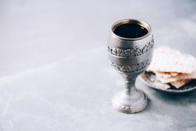 Jesish Kiddush Wine Cup For Passover With Matzot, Matzo Bread. Pesah Holiday. Banner With Copy Space. Christian Communion Concept For Reminder Of Jesus Sacrifice. Easter Passover
