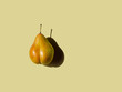 bottom-shaped pear on olive background. physical shape concept. copy space horizontal, top view