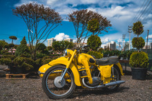Yellow Motorcycle In The Garden