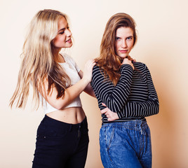 Wall Mural - best friends teenage girls together having fun, posing emotional on white background, besties happy smiling, lifestyle people concept closeup. making selfie