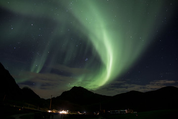 the northern lights over haukland beach.