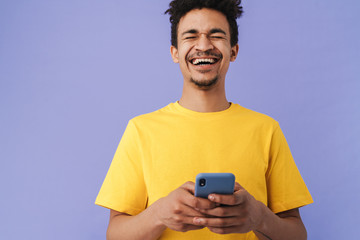 Poster - Photo of funny african american man laughing and using smartphone