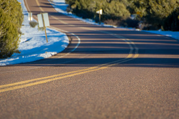 Closeup of Empty Winding Snowy road