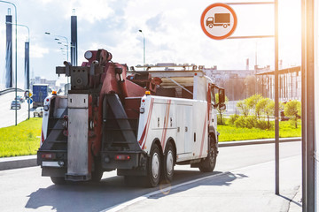 Wall Mural - Powerful big rig semi truck tractor tows driving on city highway.