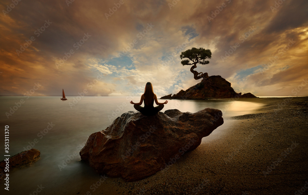 Woman doing yoga on the beach at sunrise - obrazy, fototapety, plakaty 