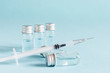 © Inna Dodor - Medical glass vials and syringe for vaccination.