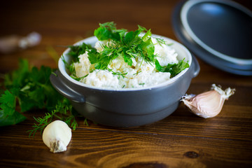 Sticker - salted homemade cottage cheese with garlic and herbs in a bowl