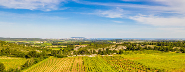 Panorama of the countryside behind Valemagne and the port of Sète in the distance in the Hérault in Occitania, France