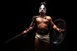 © matyuschenko - Gladiator with sword and armor on a black background