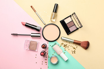 Different makeup cosmetics on color background. Female accessories