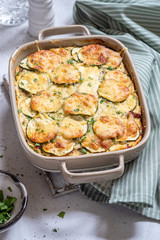 casserole with cheese and zucchini in baking dish