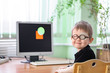 © Maxim Kukurund - A little boy wearing glasses and an eye patch (plaster, occluder). Computer 'game' software vision treatment to prevent amblyopia and strabismus (squint, lazy eye). Child congenital vision disease.