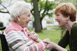 © Westend61 - Germany, North Rhine Westphalia, Cologne, Senior woman and mature woman looking at each other, smiling