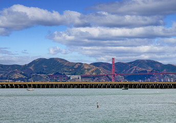 Fototapete - Famous Golden Gate Bridge Beyond San Francisco Pier