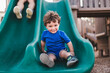 © Tamara Sales  - Frank E. Mackle Park | City of Marco Island Florida boy on playground slide