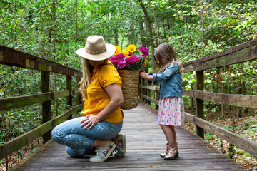 Mother Daughter with Flowers Outside